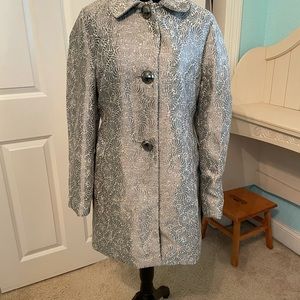 Beautiful Silver Womens dress jacket.  It has a flattering collar/buttons